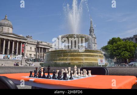 London, England, UK. 17th July, 2022. A chessboard awaits players at the ChessFest in Trafalgar Square. The annual, free, family-friendly event celebrates the iconic game with regular and giant chess boards set up all around the square for the public to enjoy, as well as performances and chess lessons. (Credit Image: © Vuk Valcic/ZUMA Press Wire) Stock Photo