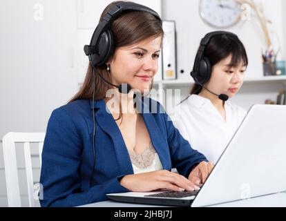 Operators working with computers in an office Stock Photo