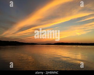 Spectacular sunset on Burntside Lake in northern Minnesota near Boundary Waters Canoe Area Stock Photo