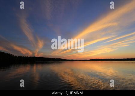 Spectacular sunset on Burntside Lake in northern Minnesota near Boundary Waters Canoe Area Stock Photo