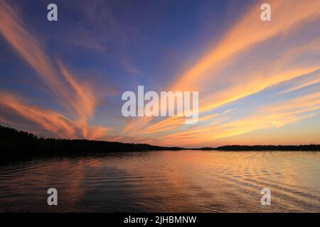 Spectacular sunset on Burntside Lake in northern Minnesota near Boundary Waters Canoe Area Stock Photo