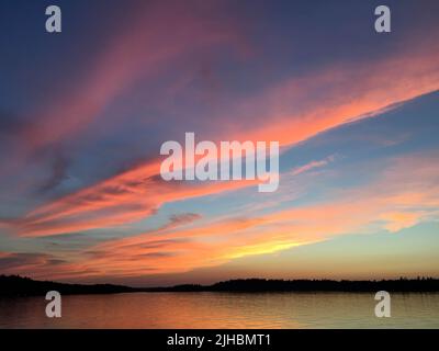 Spectacular sunset on Burntside Lake in northern Minnesota near Boundary Waters Canoe Area Stock Photo