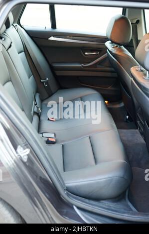 Grey leather back clean car seat side view Stock Photo