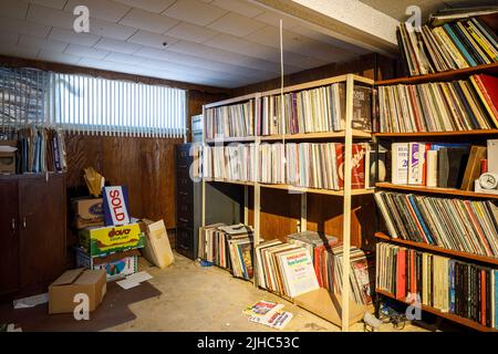 Shelves of vinyl records in a basement. Stock Photo