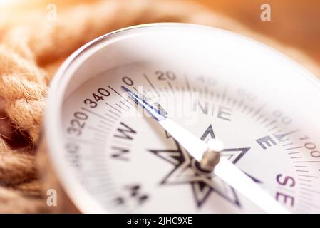 White geographic comp close up. Compass and rope Stock Photo