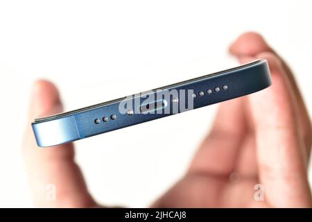 Close up of iphone's charging port with speaker and microphone isolated on white background Stock Photo