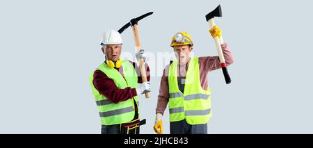 Protesting miner men on grey background Stock Photo