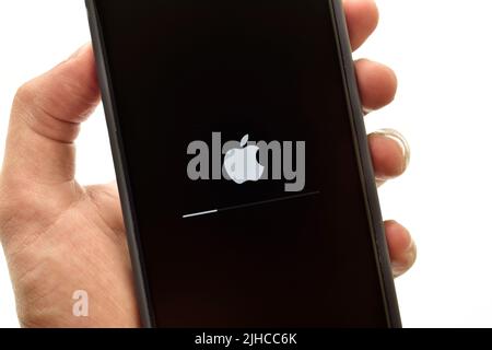New Delhi, India -  July 8, 2022: Closeup of iphone updating firmware Stock Photo