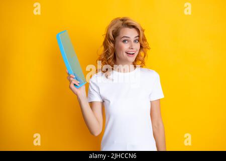 Beauty hair care. Beautiful woman combing hair. Portrait of her she nice-looking attractive lovely well-groomed cheerful holding comb. Hair effect Stock Photo