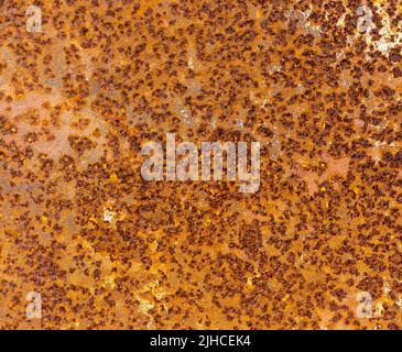 textured rusty surface of iron dirty brown, metal embossed background aged and exposed to moisture and time Stock Photo