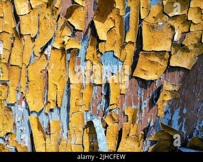 Abstration of the flag of Ukraine on a wall with a crack. A crisis. Dirty old yellow and blue wood background. Texture of wood use as natural background. Flag of Ukraine. High quality photo Stock Photo