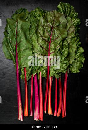 Swiss Chard on a dark surface Stock Photo