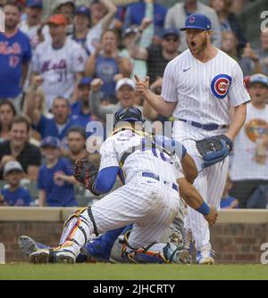 Chicago, United States. 17th July, 2022. Chicago Cubs relief pitcher Rowan Wick celebrates as catcher Willson Contreras make the tag at the plate on New York Mets Francisco Lindor for the third out of the eighth inning at Wrigley Field in Chicago on Sunday, July 17, 2022. Photo by Mark Black/UPI Credit: UPI/Alamy Live News Stock Photo