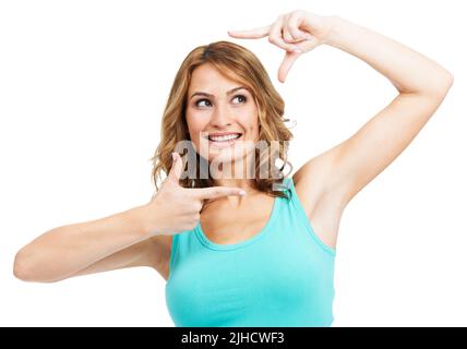 Framing a pretty portait. A young beauty framing her face with her hands while isolated on a white background. Stock Photo