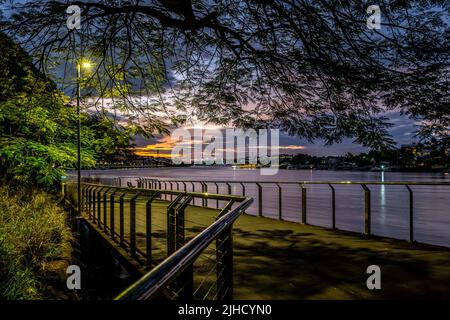 Brisbane, Australia - New Farm riverwalk along the banks of Brisbane river at sunset Stock Photo