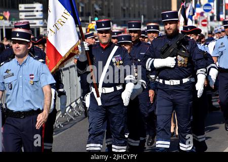 Members of French Customs parade march through the Old Port of Marseille during the National Day military parade. Stock Photo