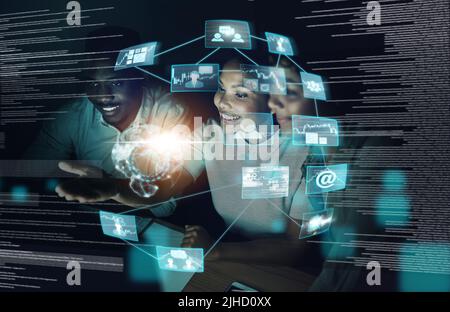 Life works out best for those who work on it. a group of young businesspeople using a computer together during a late night at work. Stock Photo