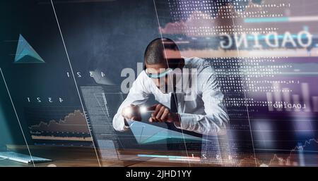 Technology is changing the way we think about business. a handsome young businessman using a digital interface. Stock Photo