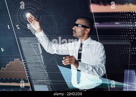 Logging in to greater opportunities. a handsome young businessman using a digital interface. Stock Photo