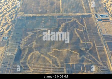 ORDOS, CHINA - JULY 17, 2022 - Aerial photo taken on July 17, 2022 shows the 'Steed Power Station' of Tianci Lake Photovoltaic power generation projec Stock Photo