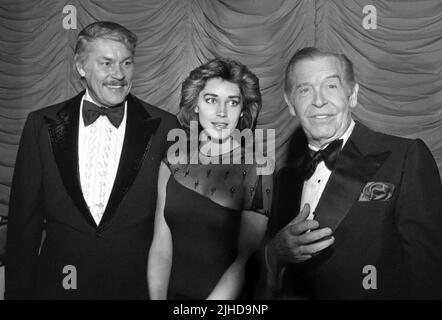 Jerry Buss, Karen Demel and Milton Berle pictured as the Friars Club of Beverly Hills Honor Sammy Davis Jr. with Lifetime Achievement Award at The Beverly Hilton Hotel on November 25, 1980. Credit: Ralph Dominguez/MediaPunch Stock Photo