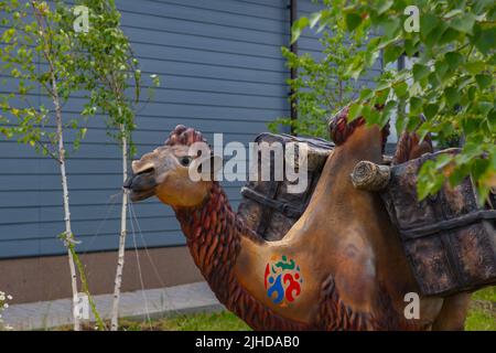 figure of a camel standing on the lawn Stock Photo