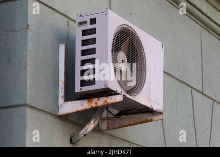 old air conditioning refrigeration unit outside the building Stock Photo