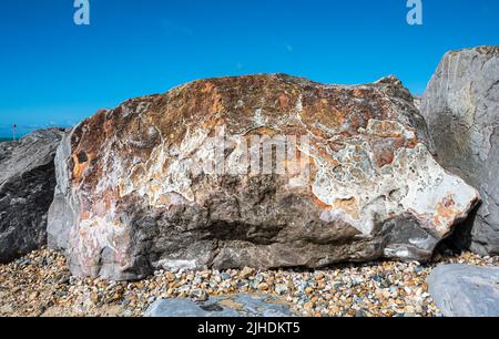 Closeup of large rocks on a beach. Stock Photo