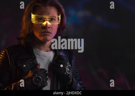 Metaverse digital cyber world technology, portrait of young man with smart glasses, futuristic lifestyle Stock Photo