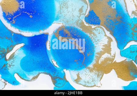 Alcohol-based ink texture in blue tones with gold. Copy space. Stock Photo