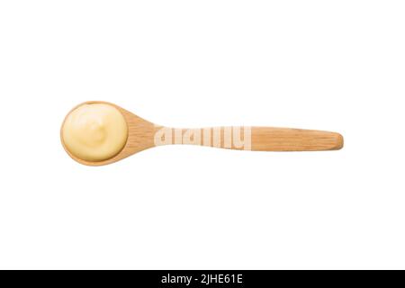 wooden spoon of cheese sauce isolated on white background. top view. Stock Photo
