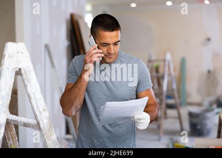 Portrait hispanic man having mobile phone conversation Stock Photo