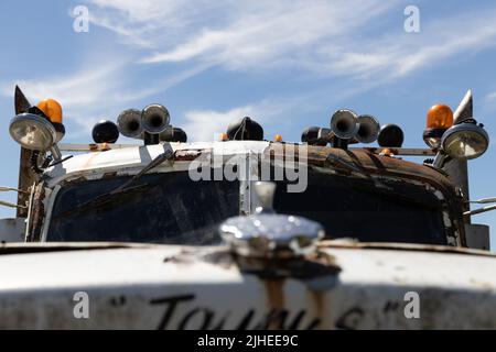 Close up of the cab, roof lights and horns of an old rusty recovery truck Stock Photo