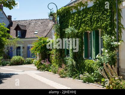 House with shutters in the picturesque village of Chedigny in the Loire Valley, central France. The village has been turned into a giant garden. Stock Photo