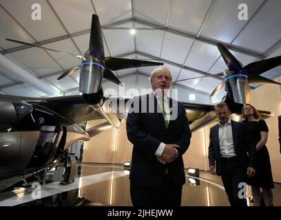 Prime Minister Boris Johnson views the display by SaxaVord, the UK Spaceport during a visit to the Farnborough International Airshow in Hampshire. Picture date: Monday July 18, 2022. Stock Photo
