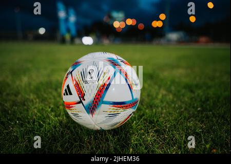 QATAR, DOHA, 18 JULY, 2022: Official Adidas Fifa World Cup Football Ball Al Rihla. World Championship in Qatar 2022. Soccer Match Ball on green grass Stock Photo