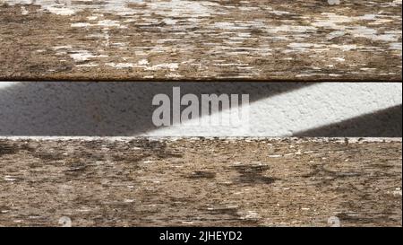 Artistic old wood plank with shadow on white wall, weathered wood, design with abstract art. grunge painting, pale color. Abstract art for book, cover Stock Photo
