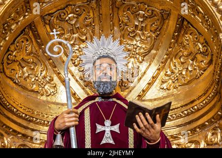 Trigueros, Huelva, Spain - April 17, 2022: Detail of head of Sculpture of San Antonio Abad (Saint Anthony Abbot),saint of trigueros, in its golden cha Stock Photo