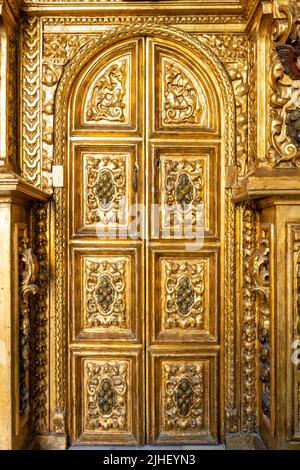 Trigueros, Huelva, Spain - April 17, 2022: Detail of golden door in the chapel of San Antonio Abad (Saint Anthony Abbot), saint of Trigueros, in Huelv Stock Photo