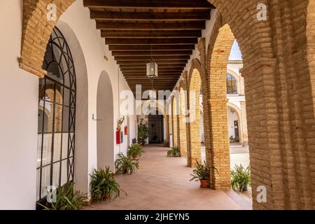 Trigueros, Huelva, Spain - April 17, 2022: Courtyard of El Convento del Carmen, former Consolación convent occupied by Carmelite religious, has its or Stock Photo
