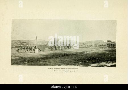 City of Ishpeming, Michigan Looking South Barnum Mine workings in the foreground from an article THE IRON-ORE REGION OF LAKE SUPERIOR. By Richard A. Parker, from Factory and industrial management Magazine Volume 6 1891 Publisher New York [etc.] McGraw-Hill [etc.] Stock Photo