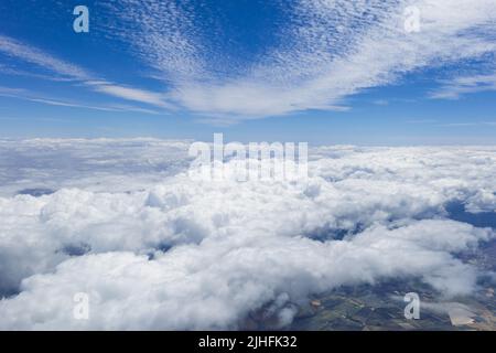 Cloud and blue sky from the airplane window Stock Photo