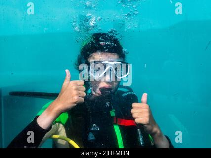 Roberts Cove, Cork, Ireland. 18th July, 2022. On one of the hottest days of the year, Jacop Jones stays cool by taking part in  a diving class in the training pool at the Oceans of Discovery dive center in Roberts Cove, Cork, Ireland. - Credit; David Creedon / Alamy Live News Stock Photo