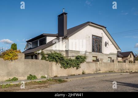 two-story concrete or brick country house Stock Photo