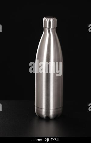 Thermo Water Bottle Isolated on White. Stainless Steel Thermos with Double Walls Front View. Silver Insulated Drinking Cups. Modern Travel Mug. Tumble Stock Photo