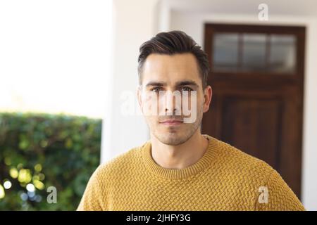 Image of serious caucasian man looking at camera Stock Photo