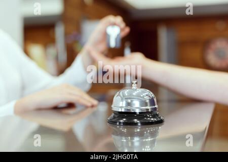 receptionist giving key Stock Photo