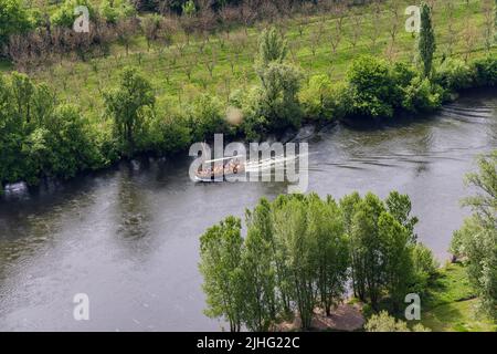 Vezac, Dorforgne, France - May 2, 2022: Awerial view on The Gabares traditional flat-bottomed boats along the river Dordogne in France Stock Photo