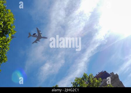 Paris, France. July, 14. 2022. One military aircraft in the sky on parade of Bastille Day. A plane silhouette viewed from below. Stock Photo