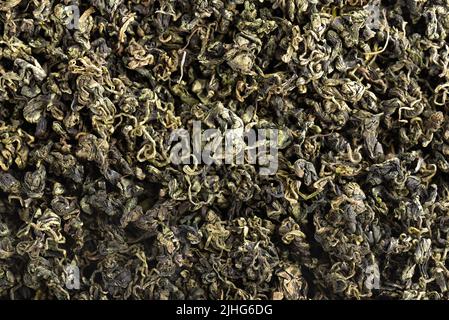 Dry gynostemma pentaphyllum leaf blackground. Jiaogulan or Miracle grass. Chinese herbal tea. Top view Stock Photo